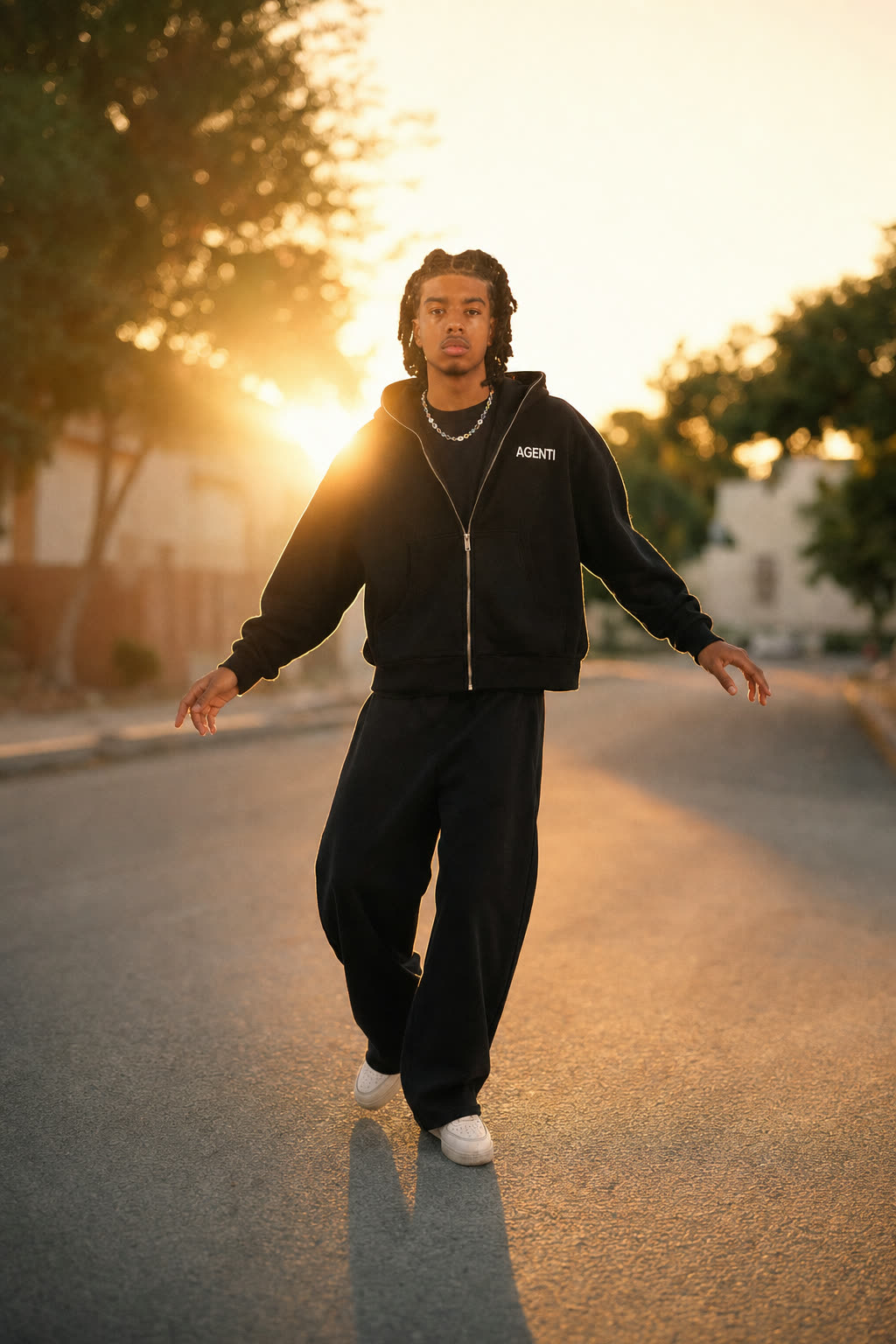 A model dancing in a sunlit street